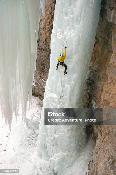 Ice Climber Extreme Adventurer On Steep Frozen Waterfall Stock Photo - Download Image Now