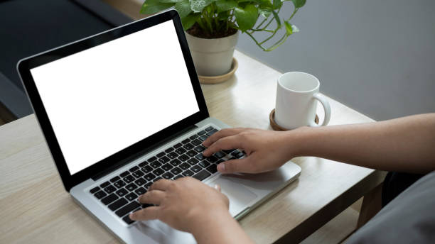 istock Young man working online with laptop computer at home. 1344371159