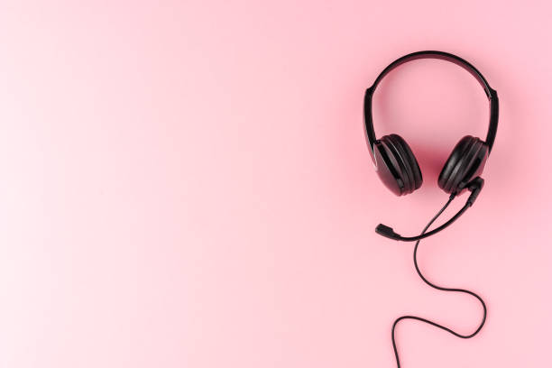 istock Overheadshot of headset on background with copyspace. Call center concept 1344371165