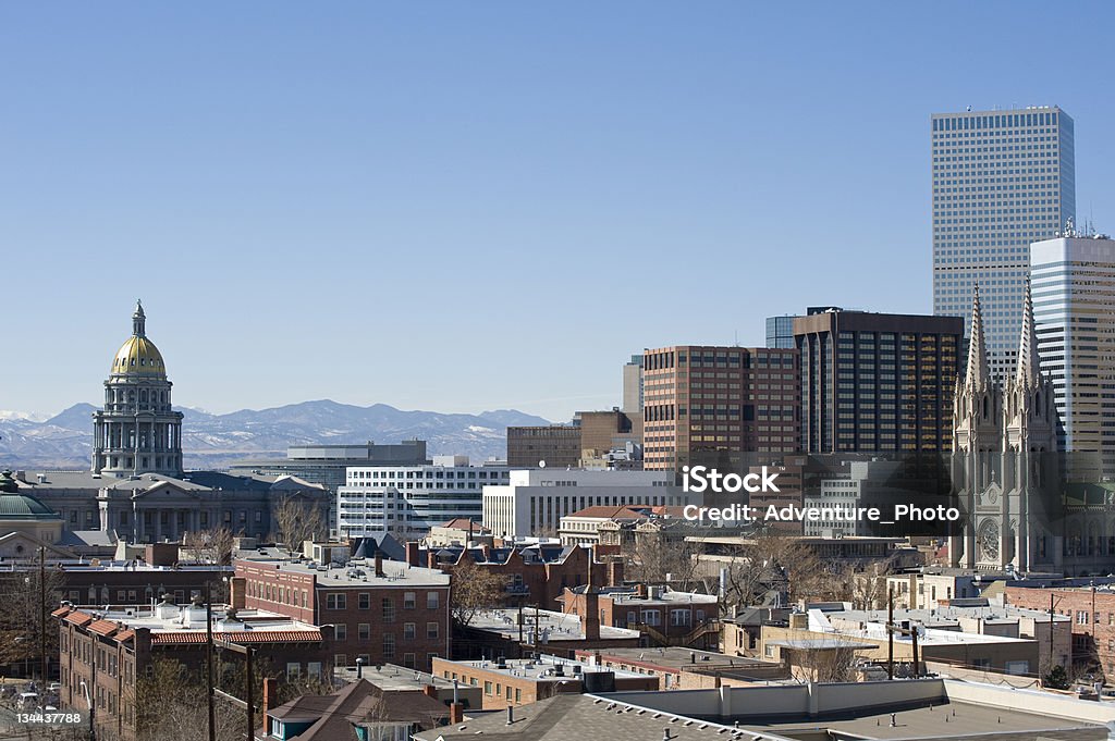 Denver State Capitol Building and Skyline with Mountain View Denver State Capitol Building and skyline with Mountain View on a sunny day with blue skies. Denver Stock Photo
