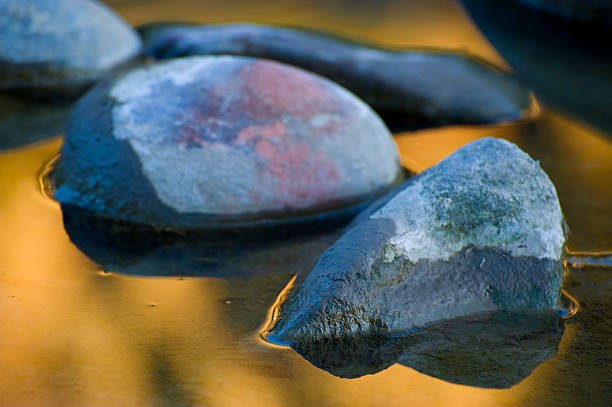 istock Scenic Rocks at Sunset Reflected in Water 134437812