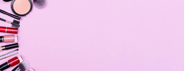 istock Make up the essentials. A set of professional makeup brushes and cosmetics on a pink background. 1344378412