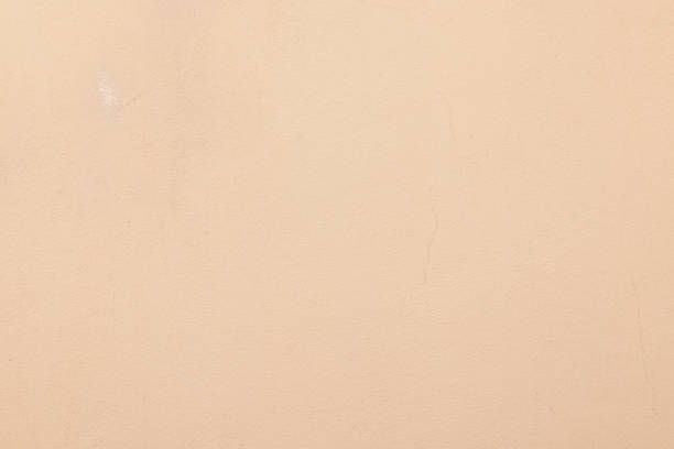 istock Part of a peach colored concrete wall 1344382558