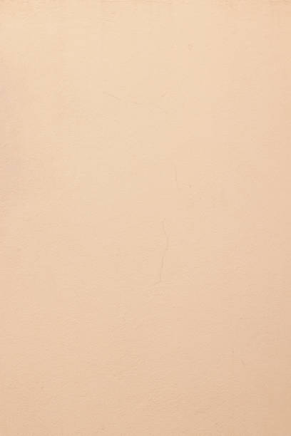 istock Part of a peach colored concrete wall 1344382561