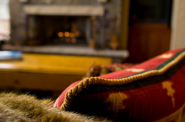 istock Cozy Couch and Pillows in front of Fireplace 134438306