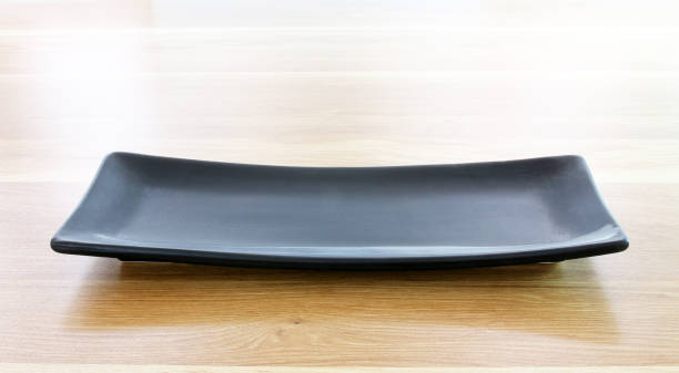 istock modern plate on wood table background 1344383860