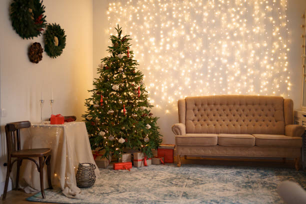 istock Christmas living room with a christmas tree and presents under it 1344385518