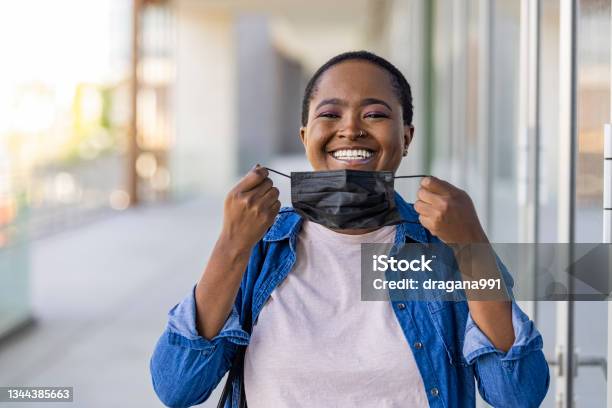 Woman Wear With Protective Face Mask Stock Photo - Download Image Now - Protective Face Mask, Removing, Resilience