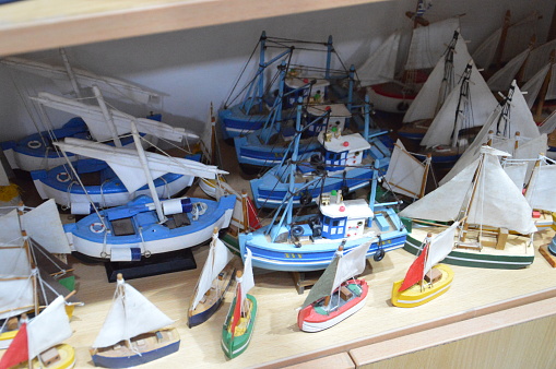 Multicolored model ships on a store shelf on the island of Rhodes in a Greece