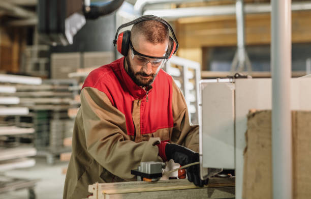 istock Employee in factory, working on CNC machines 1344388996
