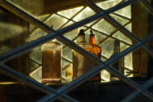 Old Saloon Whiskey Bottles with Cobwebs