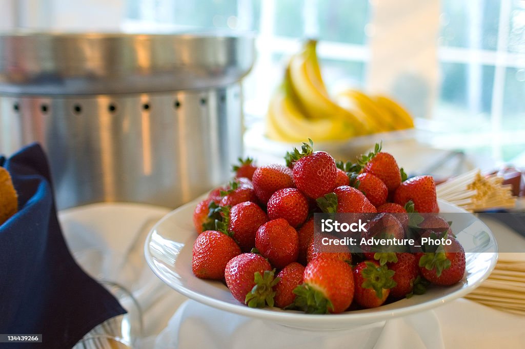 Chocolate Fondue with Bowl of Fresh Strawberries and Bananas Chocolate Fondue with Bowl of Fresh Strawberries and Bananas.  Bowl of fresh fruit to serve with melted hot chocolate fondue.  Converted from 14 bit RAW file.  sRGB color space. Banana Stock Photo