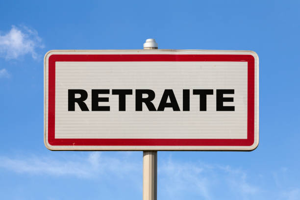 Retirement - French entry city sign A French entry city sign against a blue sky with written in the middle in French "Retraite", meaning in English "Retirement". town of hope stock pictures, royalty-free photos & images