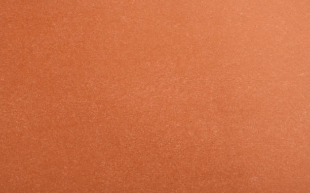 istock Abstract red glossy paper texture background or backdrop. Empty wrapping paper or shiny paperboard for decorative design element. Grainy surface for Christmas holiday or Chinese new year concept 1344395756