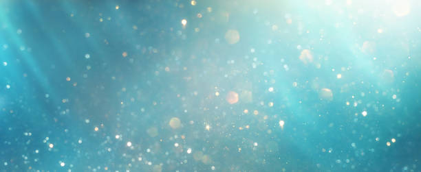 istock glitter vintage lights background. silver, blue, gold and white. de-focused 1344395809