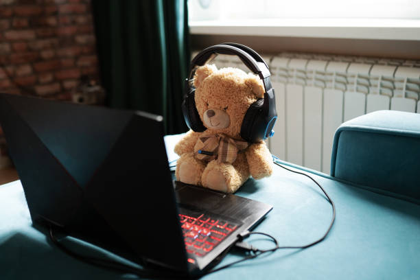 istock cute plush toys using laptop in the room 1344397771