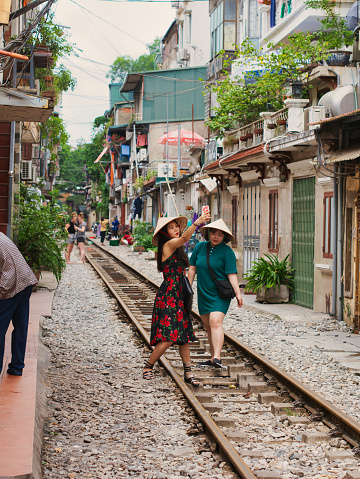 Hanoi, Vietnam - October 23, 2018: The Train Street refers to a section of railway tracks that run between Dien Bien Phu and Phung Hung streets just a few feet from houses on either side.