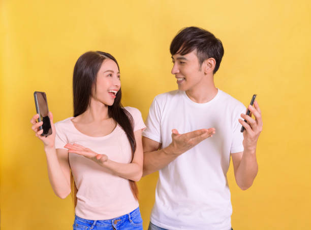 istock Happy Young  couple showing the  smartphone screen 1344405925