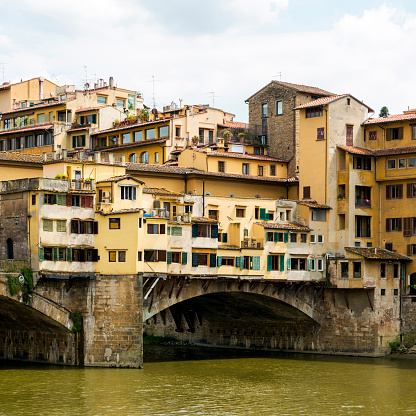 Low angle view Ponte Vecchio and river Arno, Florence, Tuscany, Italy.