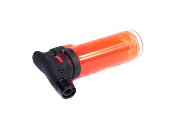 istock orange gas lighter isolated on the white 1344406759
