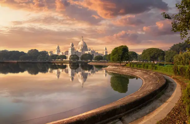 Victoria Memorial Kolkata with adjoining garden and lake at sunset