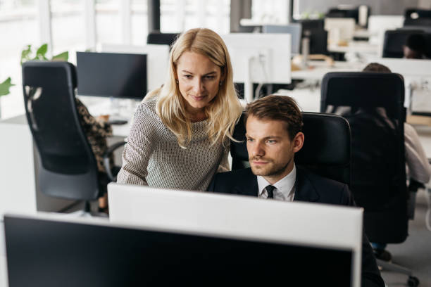 istock Two young colleagues focusing on a work dilemma 1344410387