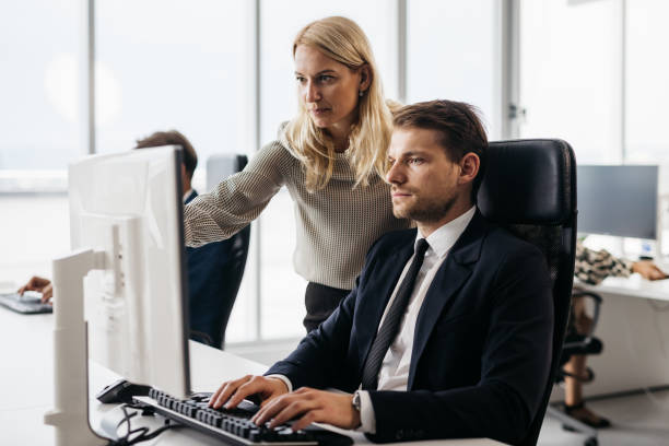 istock Businessman consulting his colleague about a work issue 1344410388