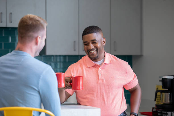 istock Mid Adult Men at a party 1344410854