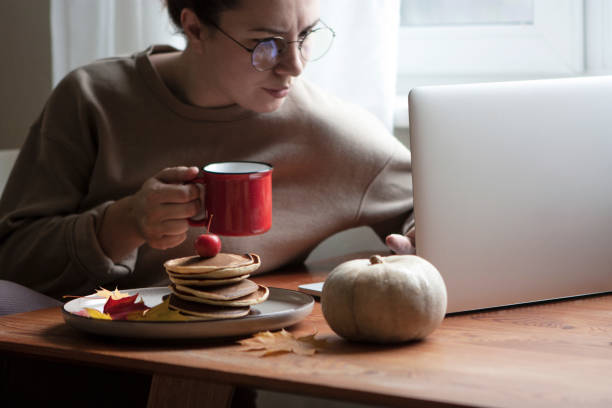 Woman working at home stock photo