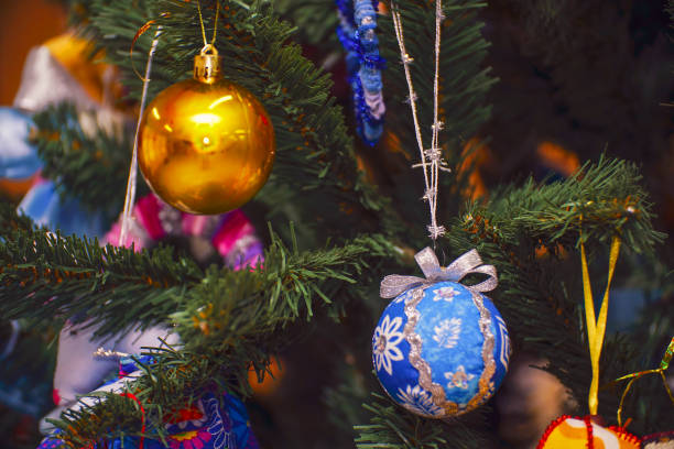 istock Christmas balls on the Christmas tree branch. Magic lights 1344411918