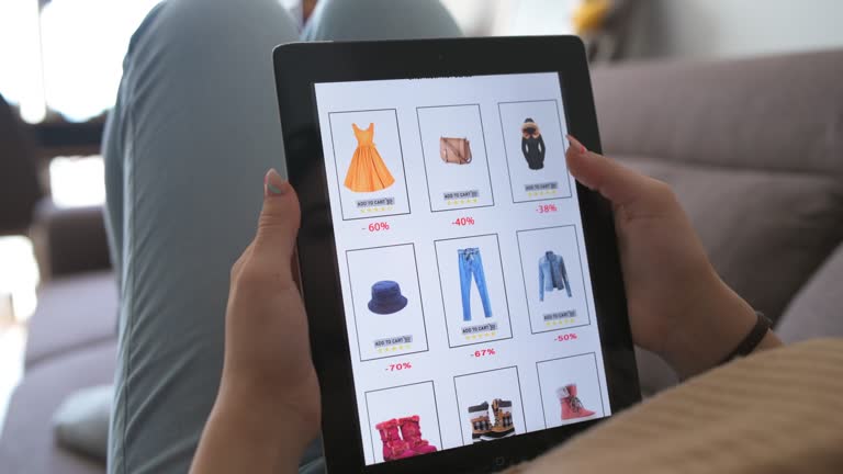 Woman is relaxing at home with her dog and shopping online clothes during Black Friday discount.