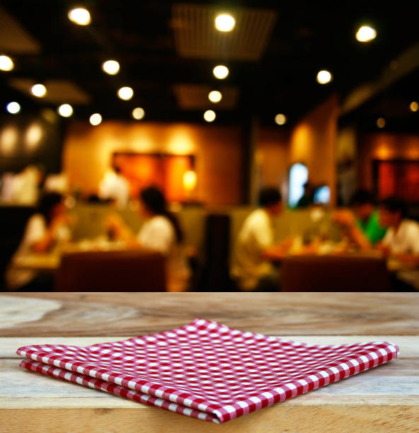 istock tablecloth and customer at restaurant blur background with bokeh 1344412518