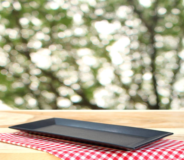 istock the plate on checkered tablecloth and  blur background with bokeh 1344412553
