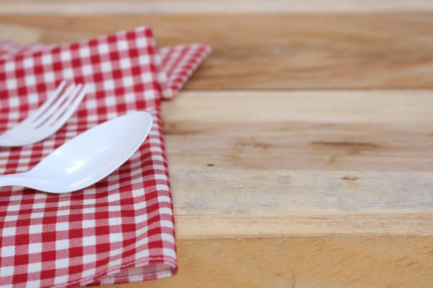 istock fork and spoon on  tablecloth for food serving background 1344412559