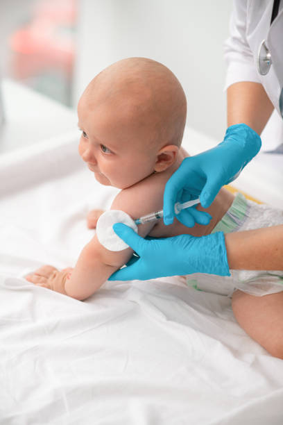 istock Baby receiving an injection in the upper arm 1344412754