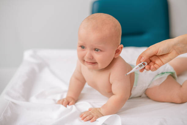 istock Doctor preparing a neonate for a temperature measurement 1344412777