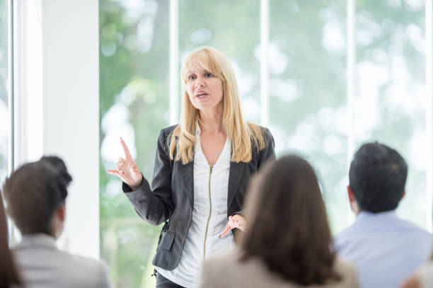 istock Woman Giving a Business Presentation 1344412916
