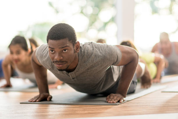 istock Push=Ups During a Multi-Ethnic Fitness Class 1344412946