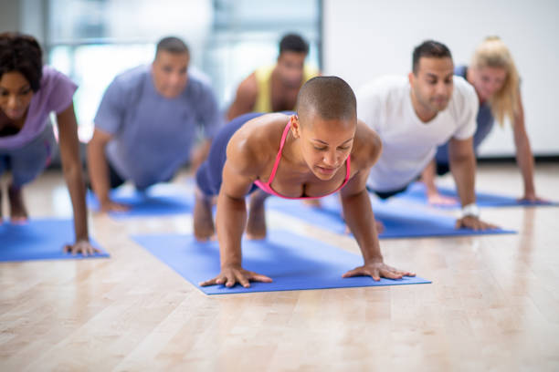 istock Adult Fitness Class Doing Push-Ups 1344412981