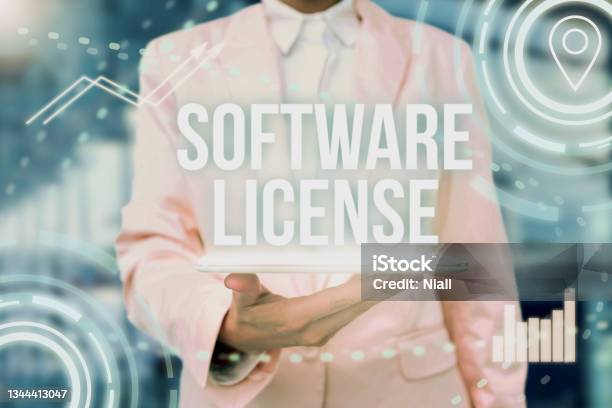 Hand Writing Sign Software License Internet Concept Legal Instrument Governing The Redistribution Of Software Lady Uniform Standing Tablet Hand Presenting Virtual Modern Technology Stock Photo - Download Image Now
