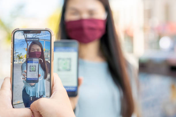 istock Retailer Scanning a Patrons Vaccine Passport 1344413147