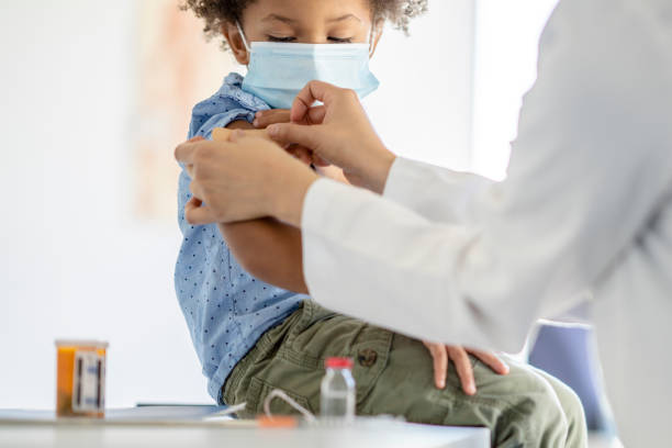 istock Boy Receiving a Vaccination During a Pandemic 1344413193