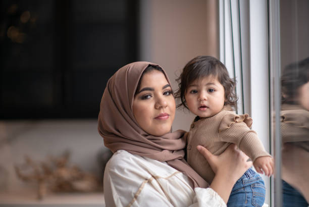istock Looking Out the Window with Mommy 1344413329