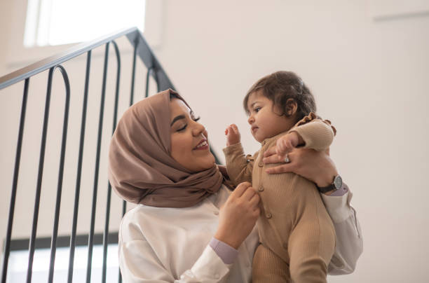 istock Sitting in the Stairway With Mommy 1344413344