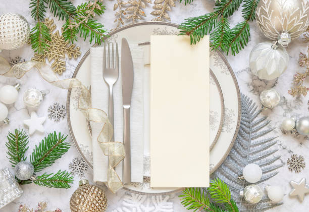 istock Festive table setting of with fir tree branches and Christmas decorations. Menu card mockup 1344413462