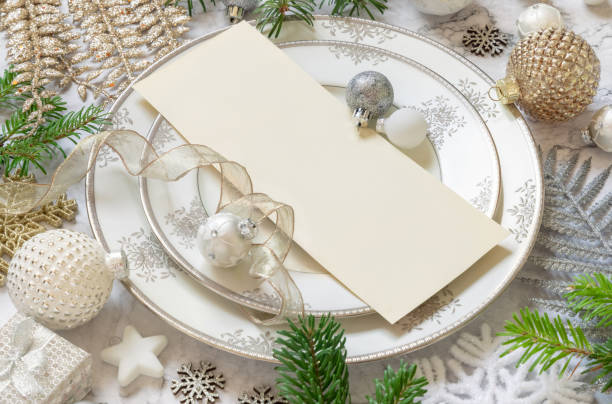 istock Festive table setting of with fir tree branches and Christmas decorations. Invitation mockup 1344413467