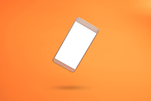 istock White 3d smartphone with empty copy space against orange background. 3D illustration design template background. Top mobile phone message. Advertisement idea. Blank copy space for ad. 1344415027
