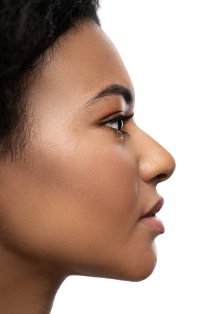 istock Young beautiful black woman with smooth skin on white background 1344415207