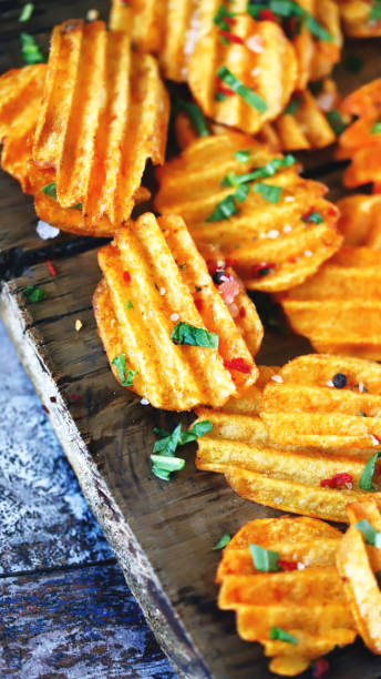 istock Chips with spices on a wooden surface. 1344415362
