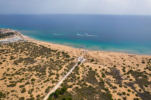 Aerial drone view over Issos beach close to Lake Korission. Agios Georgios Argirades in the distance. It is located in the southern part of Greek island of Corfu, Greece.